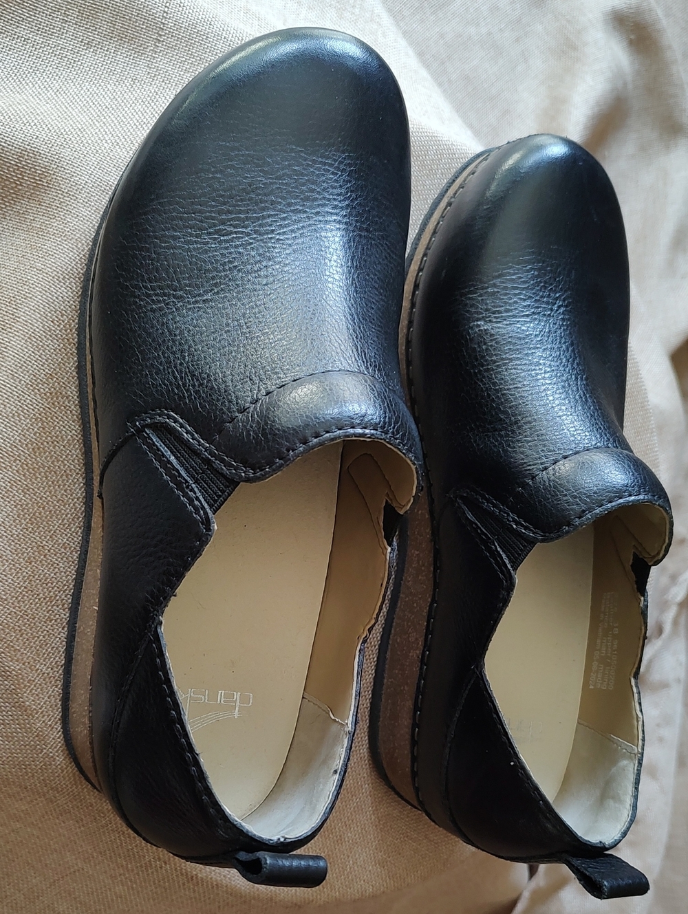 Dansko Women's Black Slip-On Leather Clogs